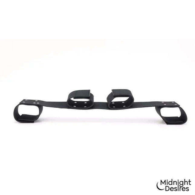 Flexible Bondage Bar by Midnight Desires, featuring vegan leather and sturdy hardware for versatile restraint options.