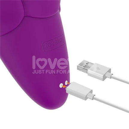 Flicker Stimulator flower-inspired vibrator with USB charging cable, featuring silicone exterior and ABS core for body-safe use.