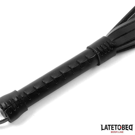 Flogger Leather 50 cm from Latetobed BDSM Line, featuring black leather handle and straps for intense and elegant intimate play.