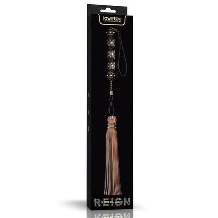 Flogger Rebellion Reign 23.5 in elegant packaging featuring luxurious black and brown PU leather wrapped handle and soft synthetic leather tails.