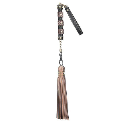 Flogger Rebellion Reign 23.5 with black and brown PU leather handle showcasing its soft synthetic leather tails.