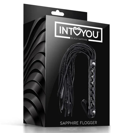 Black Saphire Flogger Sapphire Vegan Leather in packaging, featuring a sleek, nickel-free design for luxurious and safe play.