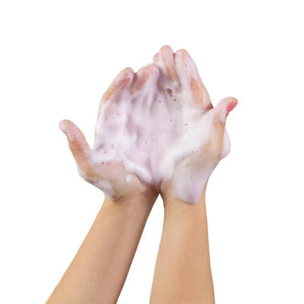 Hands covered in rich, luxurious foam from Foaming Shower Gel, creating a velvety texture, enhancing skin hydration and nourishment.