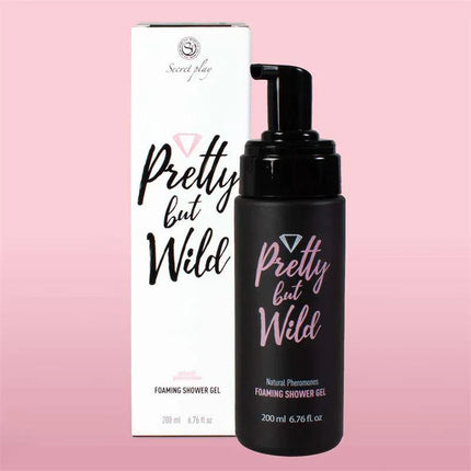 Pretty but Wild Foaming Shower Gel bottle and packaging on a pink background, luxurious skincare product enriched with plant actives.