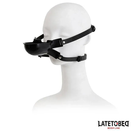 Gag with Drinker, adjustable black gag for role-play, shown on mannequin head, featuring sleek design for discreet intimacy.