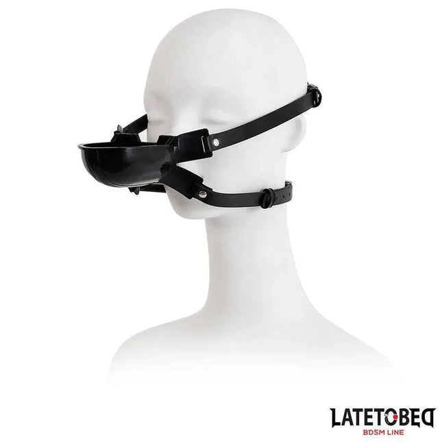 Gag with Drinker, adjustable black gag for role-play, shown on mannequin head, featuring sleek design for discreet intimacy.