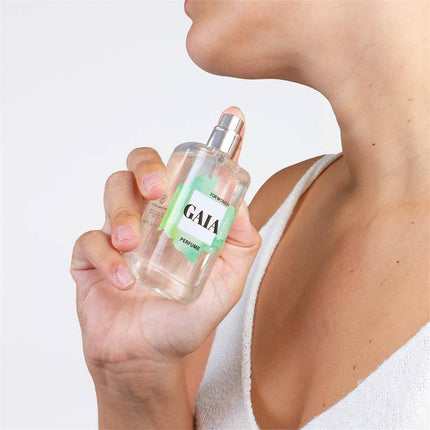 Woman holding Gaia Natural Pheromones Perfume 50 ml bottle, highlighting its appeal and confidence-boosting qualities.