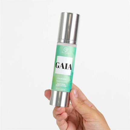 Hand holding Gaia Silk Skin Body Lotion 50ml for soft and hydrated skin in a sleek bottle.