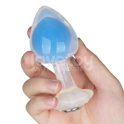 Glow in the Dark Butt Plug - Gemoria Steel Ball Design in hand, showcasing blue illumination and ergonomic shape for luxurious pleasure.