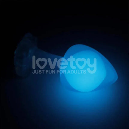Glow in the Dark Butt Plug - Gemoria Steel Ball Design glowing in blue in dark setting