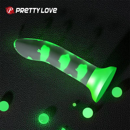 Glow in the Dark Dildo with Suction Cup and Harness illuminating in dark setting