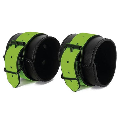 Glow in the Dark Handcuffs made of neoprene and vegan leather with luminous green glow, perfect for bold expression of sexuality.