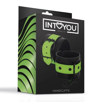 Glow in the Dark Handcuffs by Intoyou in black and green packaging, featuring a luminous neoprene and vegan leather design.