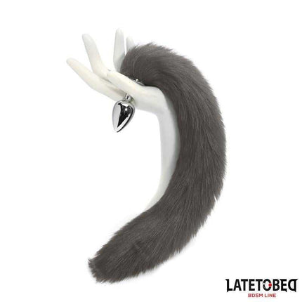 Gray 40 cm Anal Plug with Silky Tail by Latetobed BDSM Line displayed on a mannequin hand.