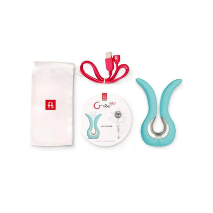 Gvibe Mini Stimulator Tiffany Mint with accessories, including charging cable and storage pouch