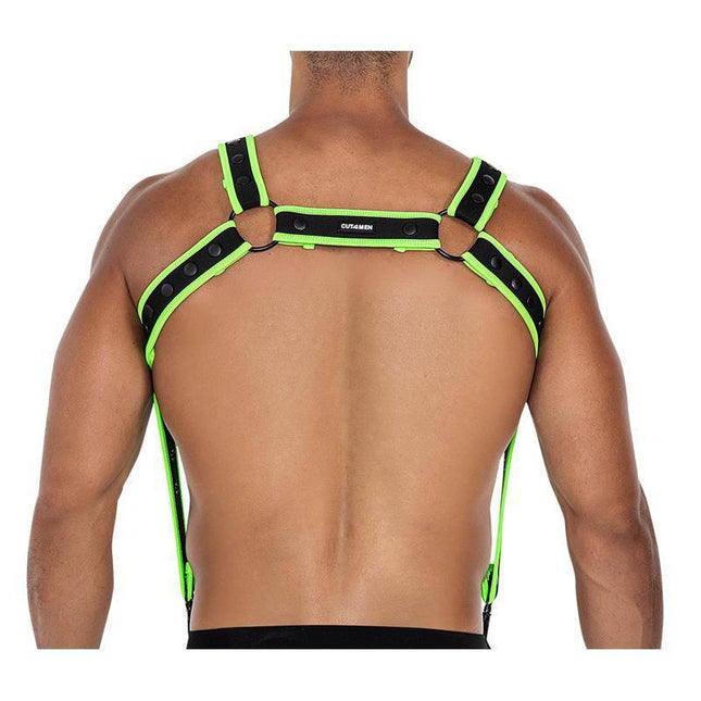 Back view of model wearing H4RNESS05 Chest Harness Neon Green One Size, highlighting neoprene material and bold neon accents.