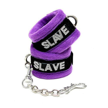 Purple handcuffs with 'slave' inscription from the Handcuffs and Eyemask Purple set, designed for playful restraint and intimate moments.