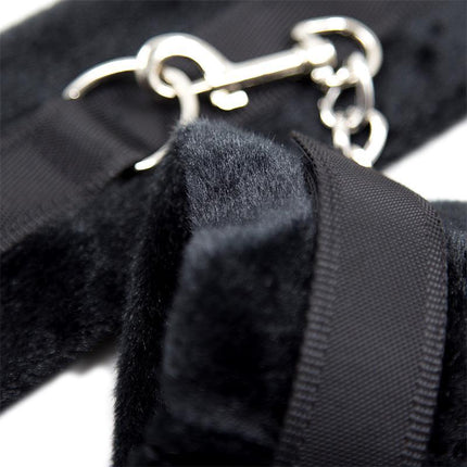 Close-up of Handcuffs with Velcro with Long Fur Black showing fur texture and metal clasp.