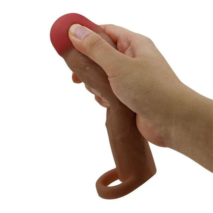 Hand holding Hani Extended Penis Sleeve showcasing realistic texture and design.