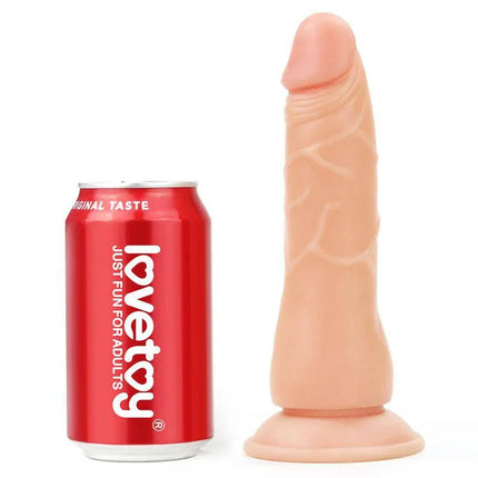 Realistic dildo next to a can for scale, showcasing the lifelike design of the Harness with Dildo Easy Strapon 7.5.