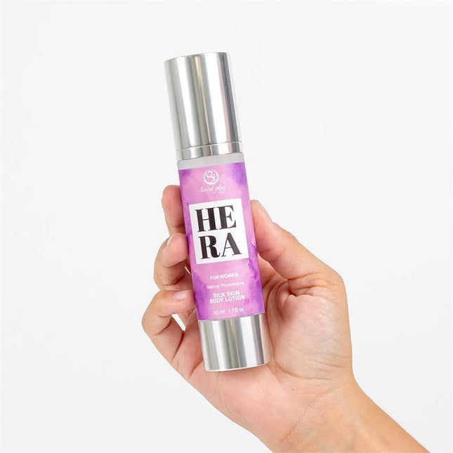 Hera Silk Skin Body Lotion 50ml in a hand, showcasing the sleek bottle design for alluring and seductive skincare appeal.