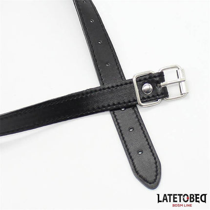 Close-up of adjustable leather strap for Hollow Hard Ball Gag featuring buckle and multiple holes for secure fit.