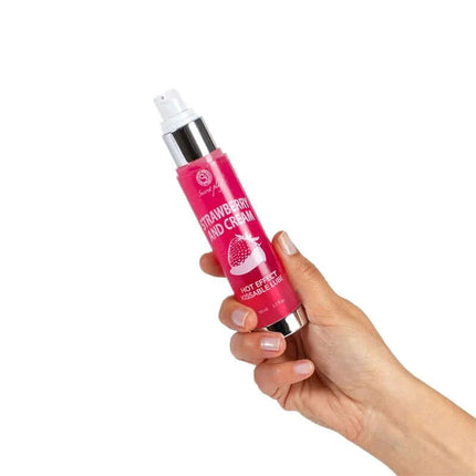 Hand holding Hot Effect Strawberry with Cream Lubricant 50 ml bottle