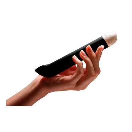 A hand holding the Joupie Stimulator Black vibrator, showcasing its sleek, slim design. Made from medical-grade silicone for safe use.