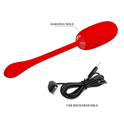 Julius Vibrating Egg Red with USB rechargeable cable shown, highlighting the charging hole on the premium silicone surface.