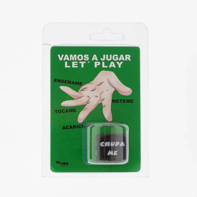 Packaged Kamasutra Action Die with Spanish phrases, against a green background