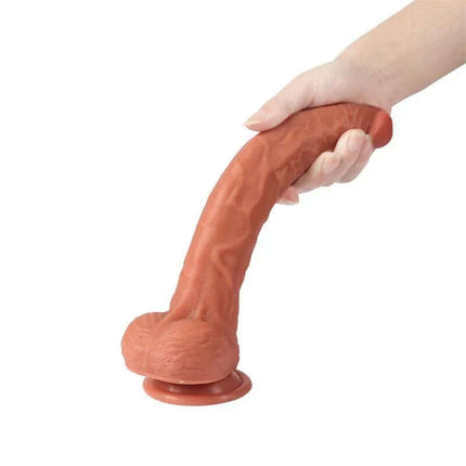 Hand holding Len Dildo Double-layered silicone 10.43, showcasing lifelike design with suction base for solo or partner play.