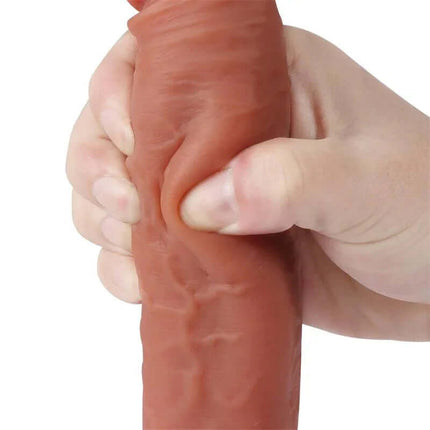 Hand squeezing Leo Dildo Double Hardness Dual Layer Silicone 9.44 showcasing soft exterior and realistic texture.