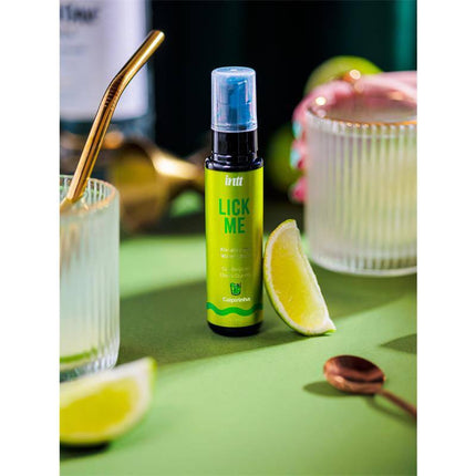 Lick Me Caipirinha Kissable Gel with Warm Effect 50 ml, featuring lime slices and cocktail setting on a green background