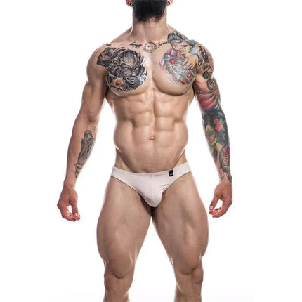 Low Rise Bikini Brief Provocative Nude by Cut4men on muscular male model showcasing sleek silhouette and comfort.