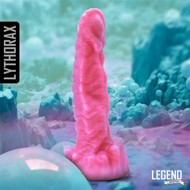 Lythorax Liquid Silicone Dildo 22 cm, pink color displayed on a colorful backdrop.