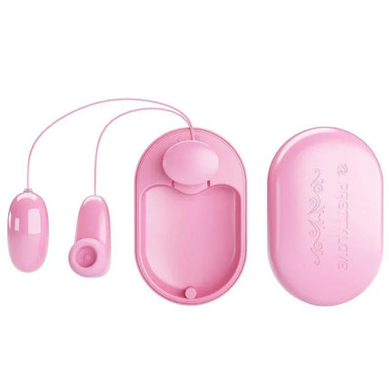 Magic Box Vibrating Egg and Tapping Stimulator in pink with remote control, showcasing its two-in-one pleasure device design.