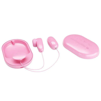 Magic Box Vibrating Egg and Tapping Stimulator in pink, featuring a compact design for versatile pleasure experiences.