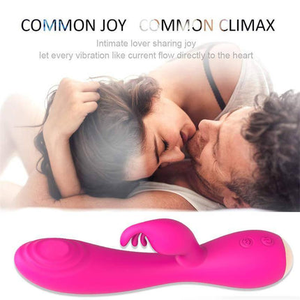 Magic Stick Rabbit Vibe with Pulsation Fuchsia beside a couple embracing intimately, highlighting pleasure and connection.