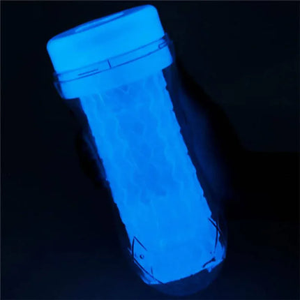 Male Masturbator Lumino Blue Light with glowing blue sleeve in dark setting