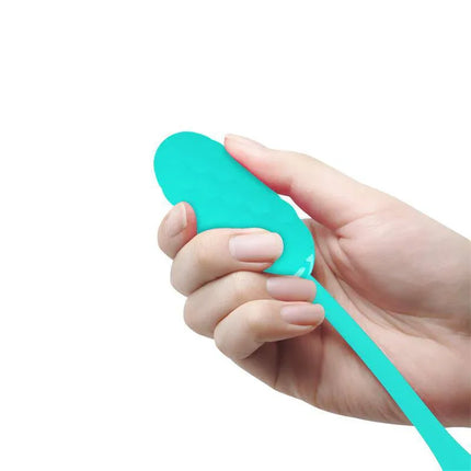 Hand holding Marina Vibrating Egg Green, a premium silicone vibrator with 12 vibration functions for versatile stimulation.