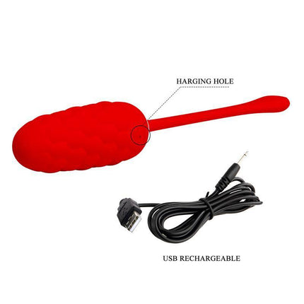 Marina Vibrating Egg Red with USB rechargeable cable, featuring a quilted texture and charging hole.
