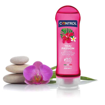 Massage Gel Thai Passion 200 ml bottle next to orchid and stones for sensual massage and intimacy.