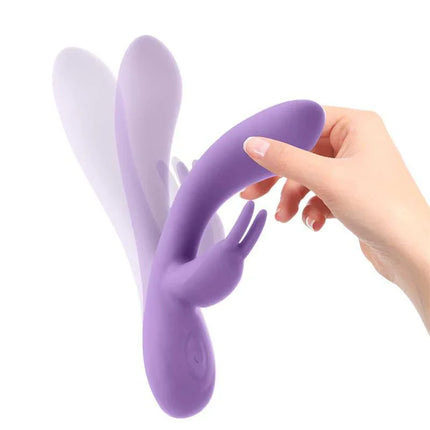 Mauve Mauve Liquefied Silicone Unibody Vibe USB Purple with flexible rabbit ear design, shown held in hand.