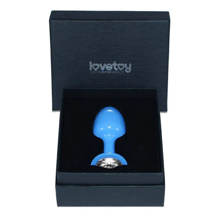 Metal Butt Plug Blue Rosebud with Clear Jewel in a black box packaging