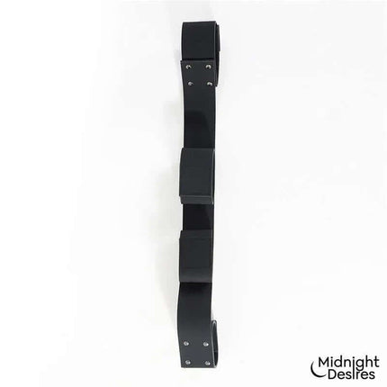 Flexible Bondage Bar by Midnight Desires made from soft vegan leather with sturdy hardware for comfortable restraint.