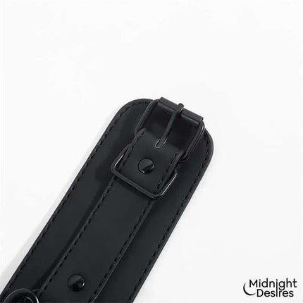 Black vegan leather strap from the Restraint Set with Collar with Leash and Cuffs by Midnight Desires.