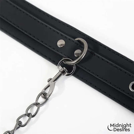 Midnight Desires' Collar and Ankle Cuffs with Chain in vegan leather, featuring adjustable buckles and detachable chain for bondage play.