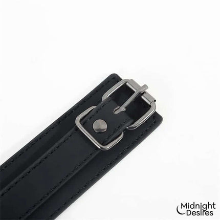 Collar and Ankle Cuffs with Chain by Midnight Desires made from vegan leather with adjustable buckle detail.
