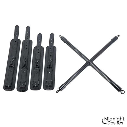 Rigid Crossed Bar with Cuffs from Midnight Desires, featuring cross-shaped spreader bar and detachable vegan leather cuffs for restraint play.