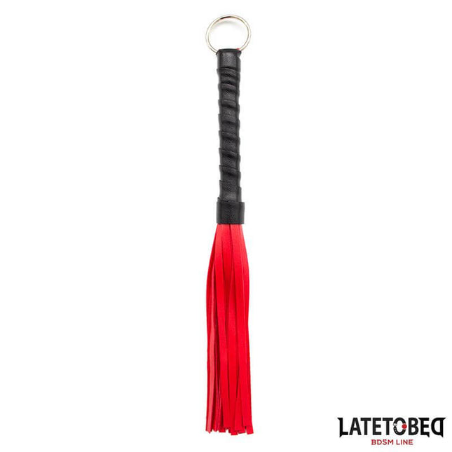 mini flogger 28cm black handle with red tails, lightweight discreet BDSM accessory on white background